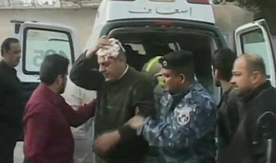 פינוי פצועים בעקבות סדרת הפיגועים בבגדאד, אתמול