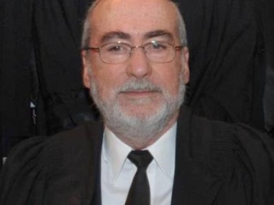 השופט שנחשד בהכאת ילדיו ישוב לכס השיפוט ב-2014