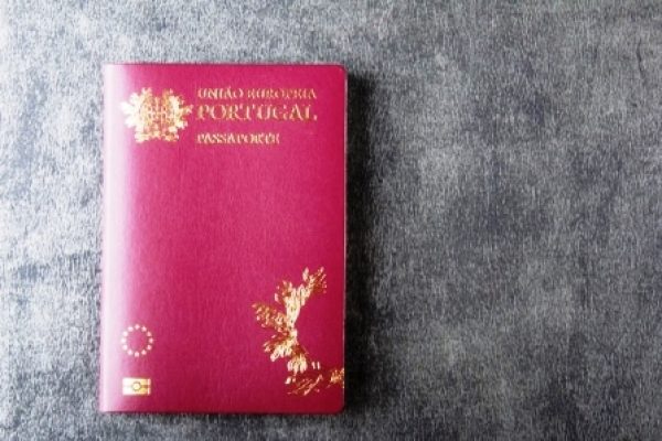 Portuguese passport isolated on gray background top view