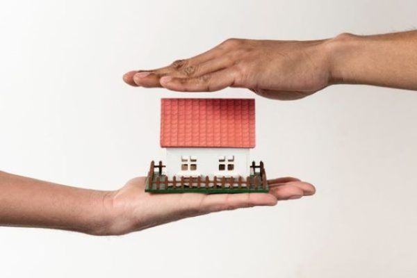 real-estate-agent-client-holding-toy-house(1)