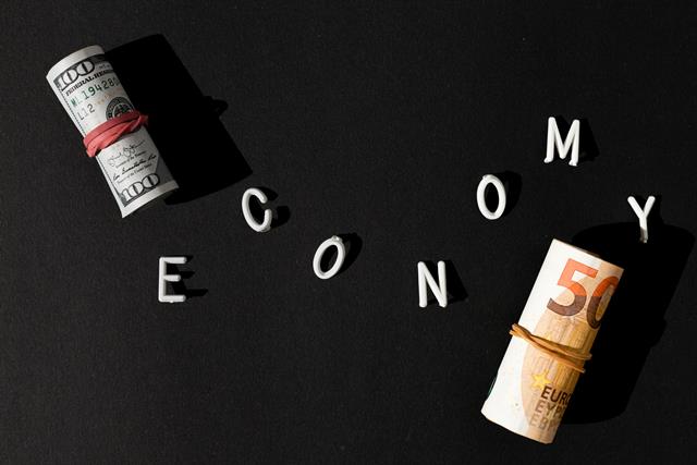 economy-word-rolls-money